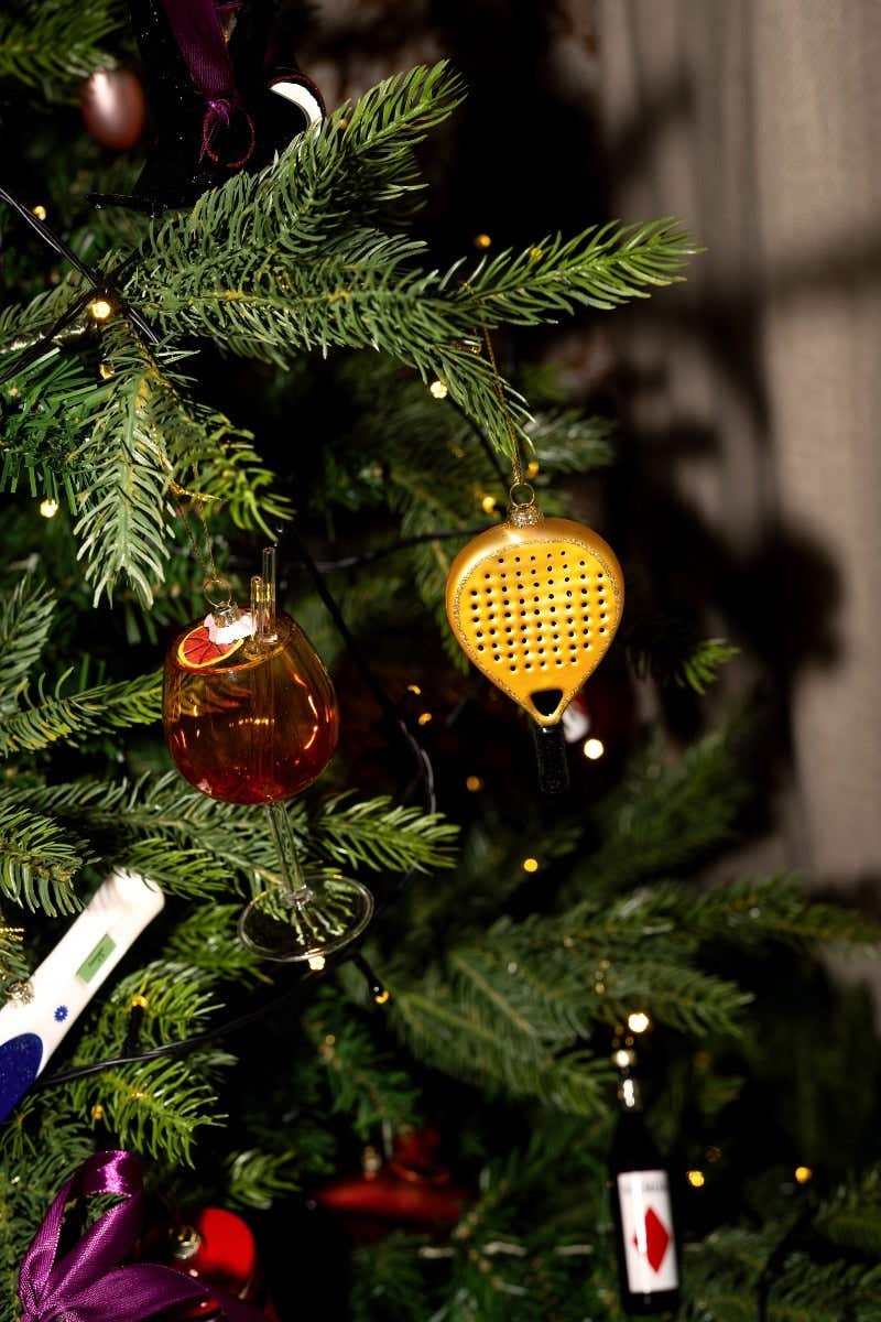 Padelracket Goud Yup in de boom